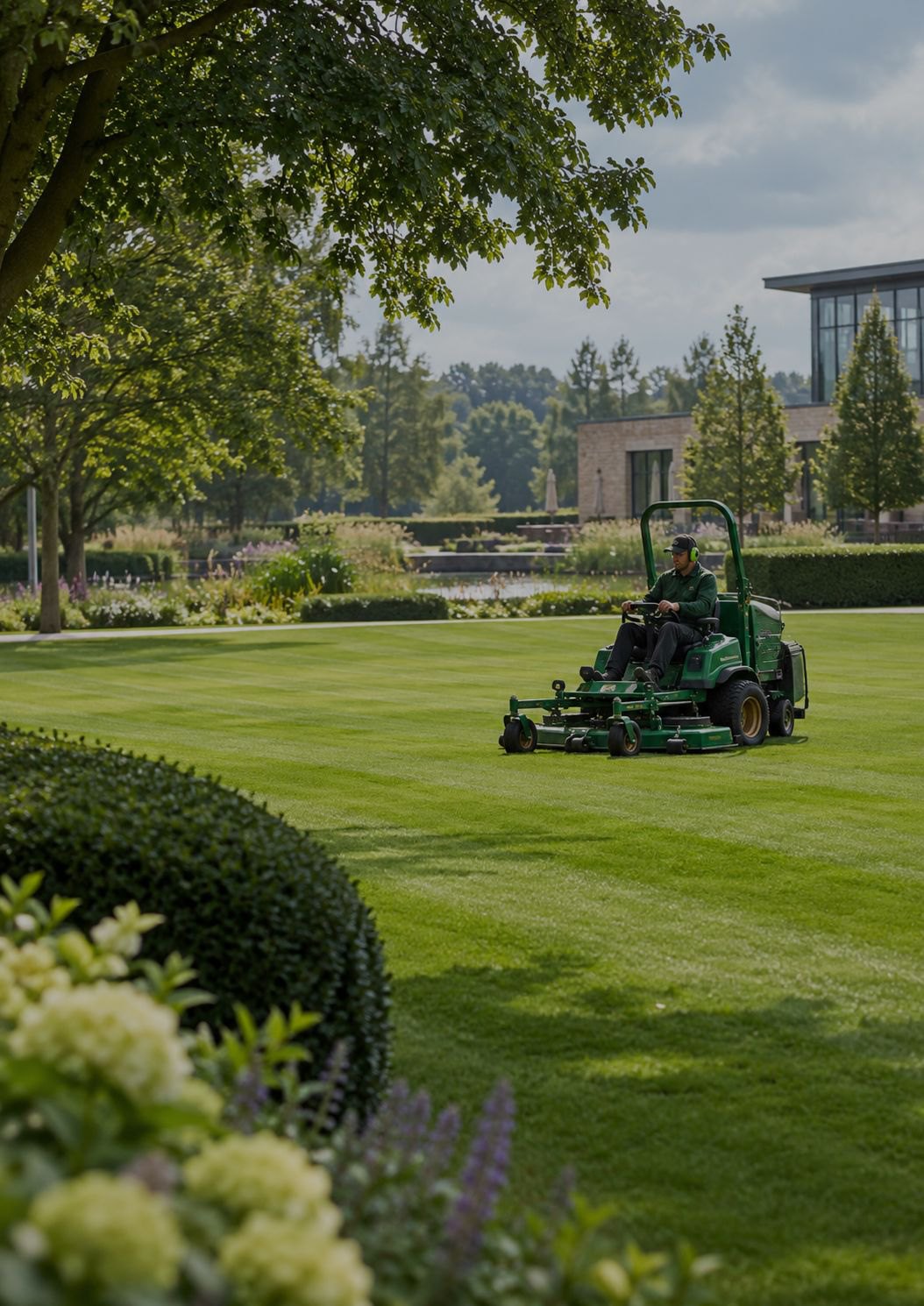 Ride-on mower on a maintained commercial lawn